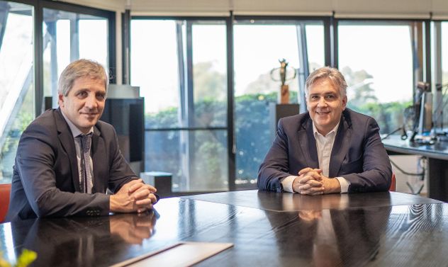 Martín Llaryora y Luis Caputo.