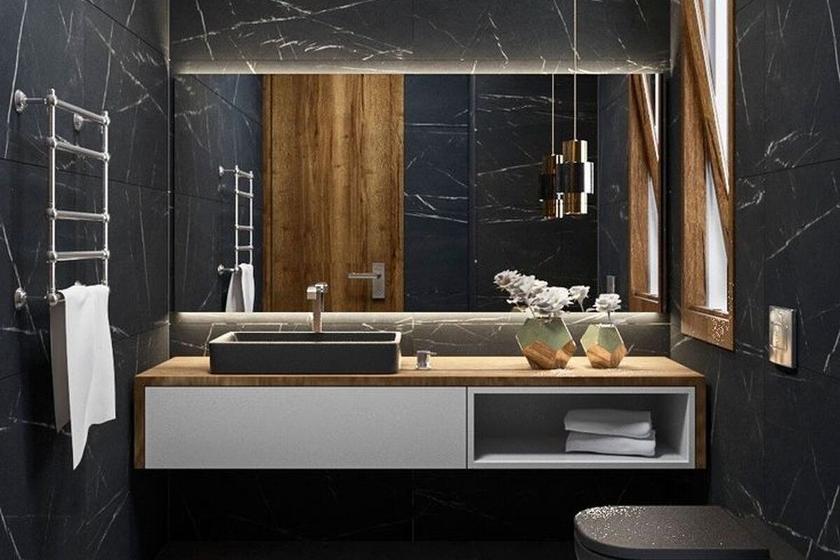 Quienes no se animan al total black pueden incorporar elementos en madera o pequeños focos de atención blanco. Foto: Pinterest