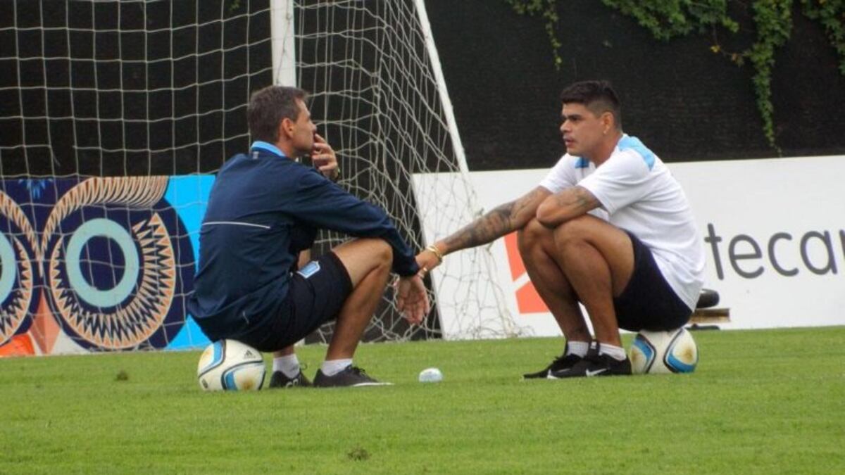 Bou junto a Cocca, en su etapa en Racing. (Archivo).